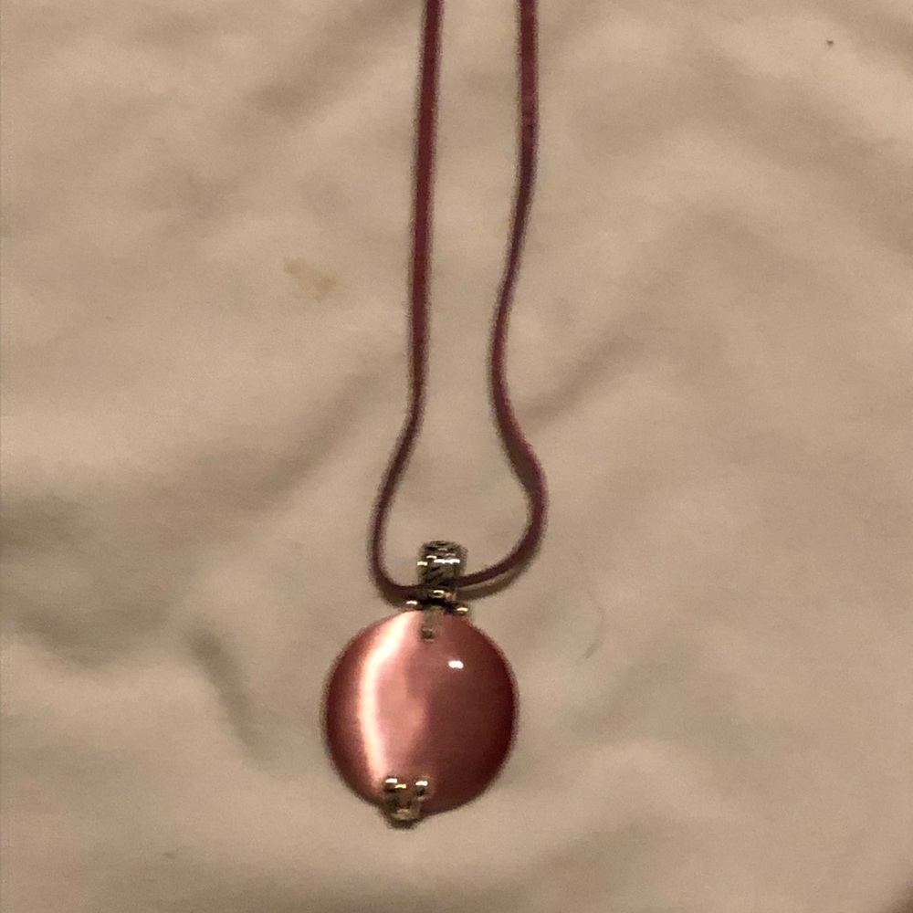 Pink gem and silver pendant